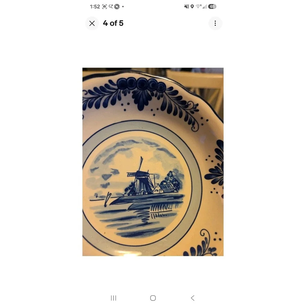 This is a vintage Delft Blue hand-painted ceramic creamer pitcher And Bowl/plate